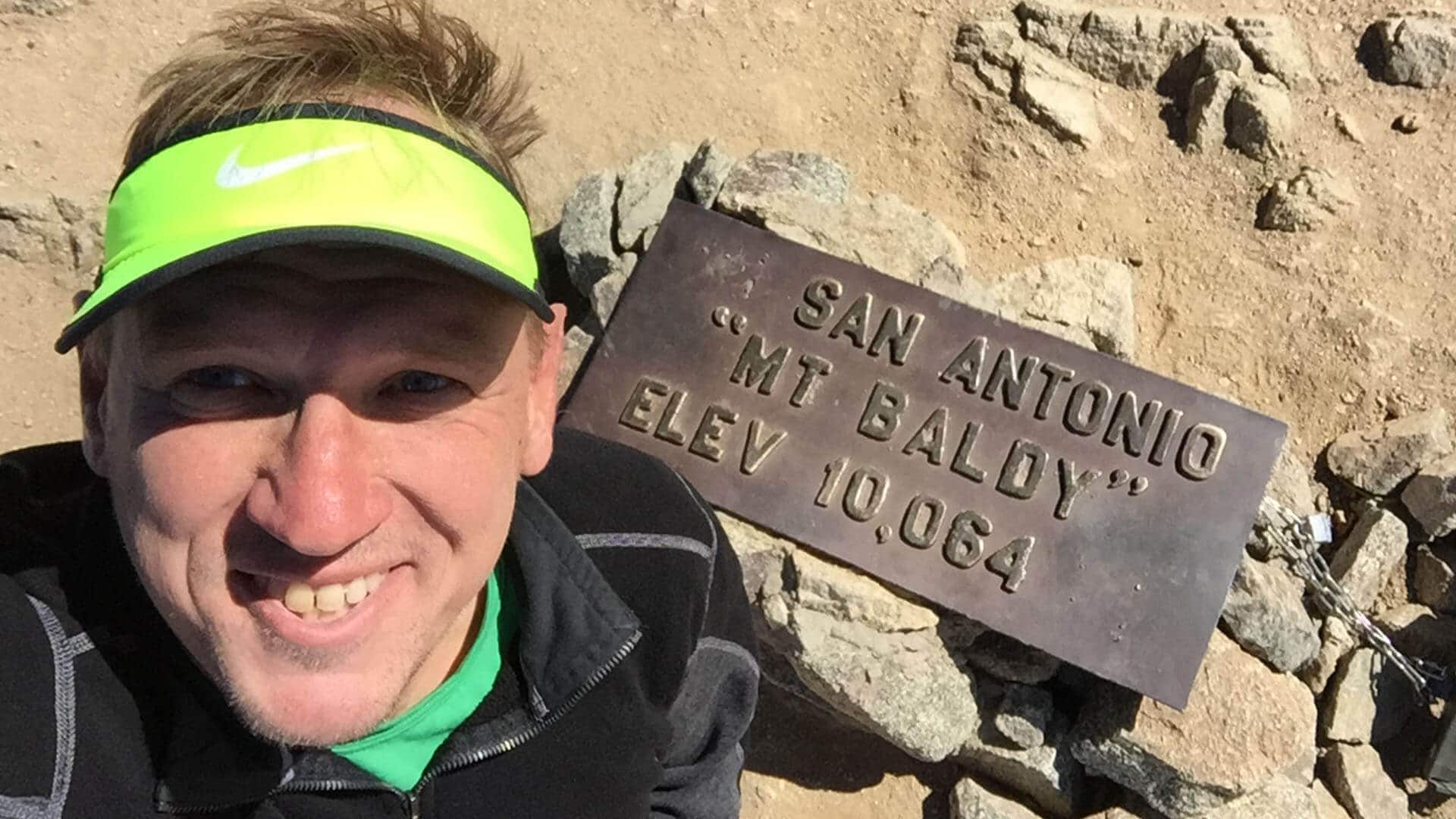 cris hazzard with Mt Baldy summit sign