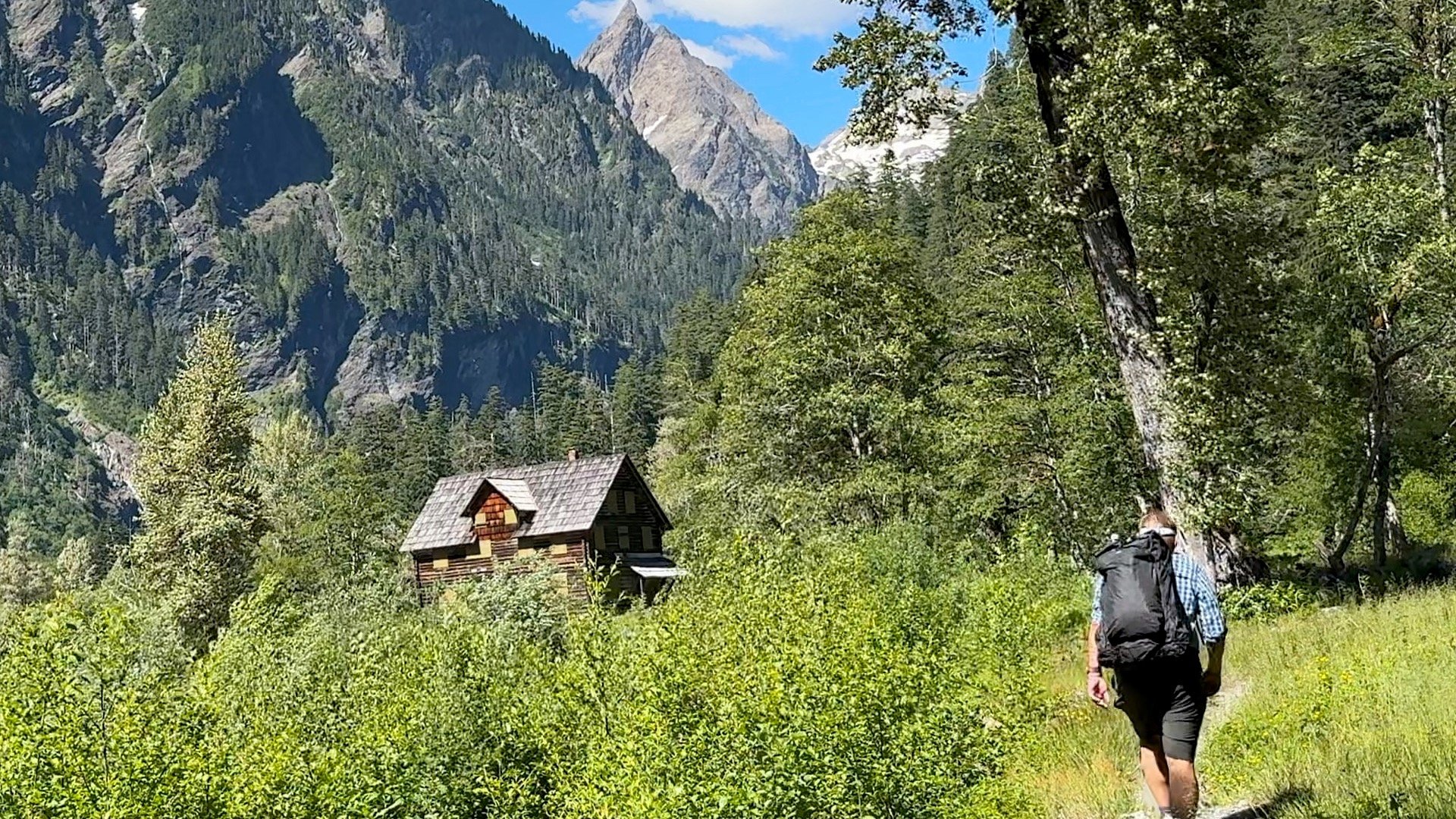 Cris Hazzard hiking by the Enchanted Valley Chalet.