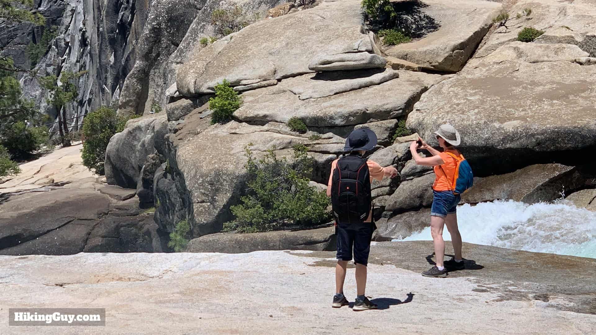 Hikers On Edge Nevada Falls